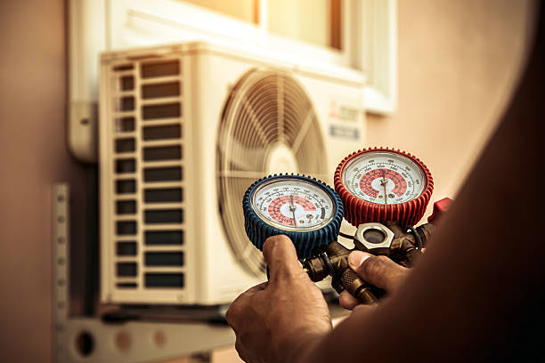 Professional Heat Pump Repair technician working in Wellington, TX